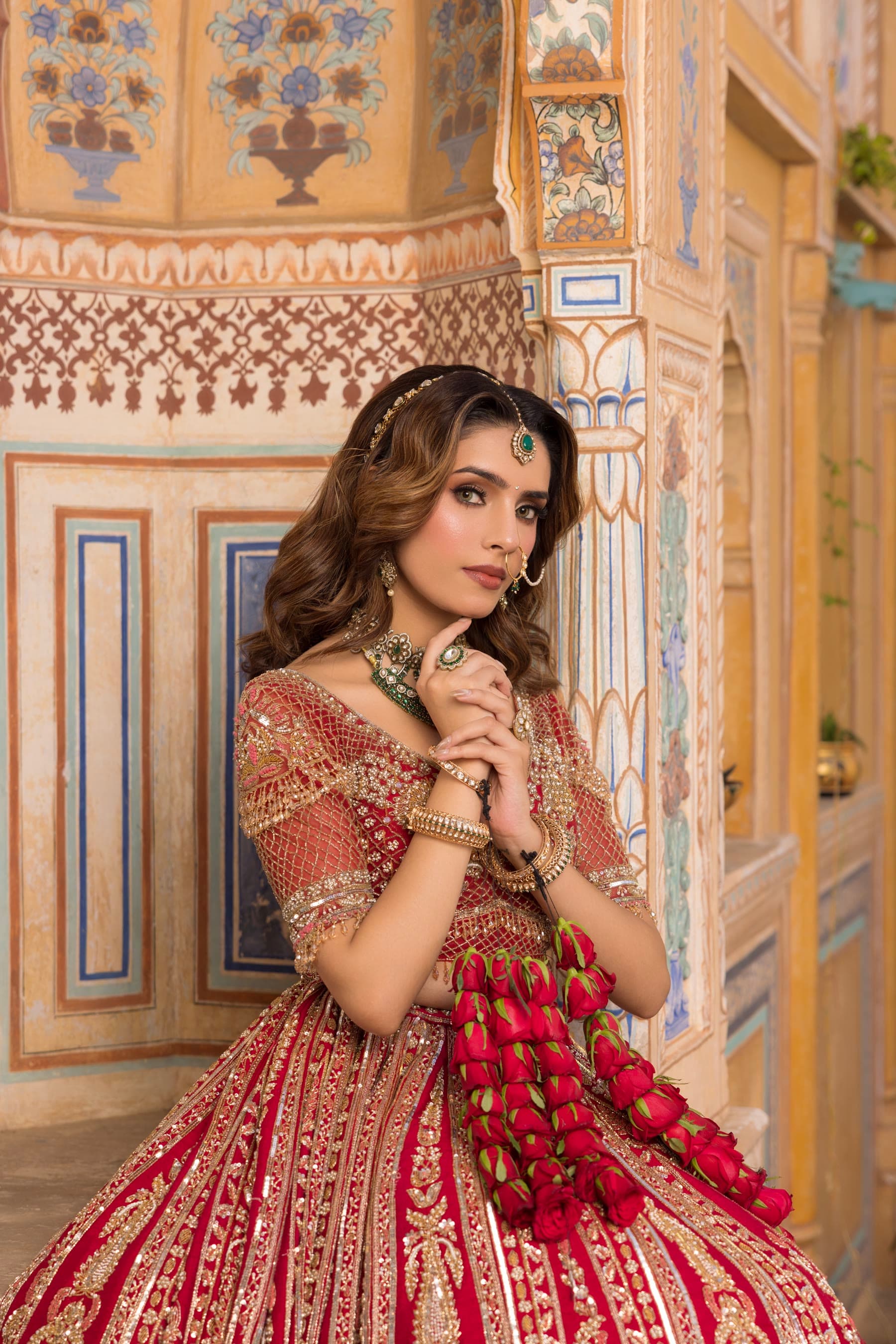 A bride holding a fall of red kaleere
