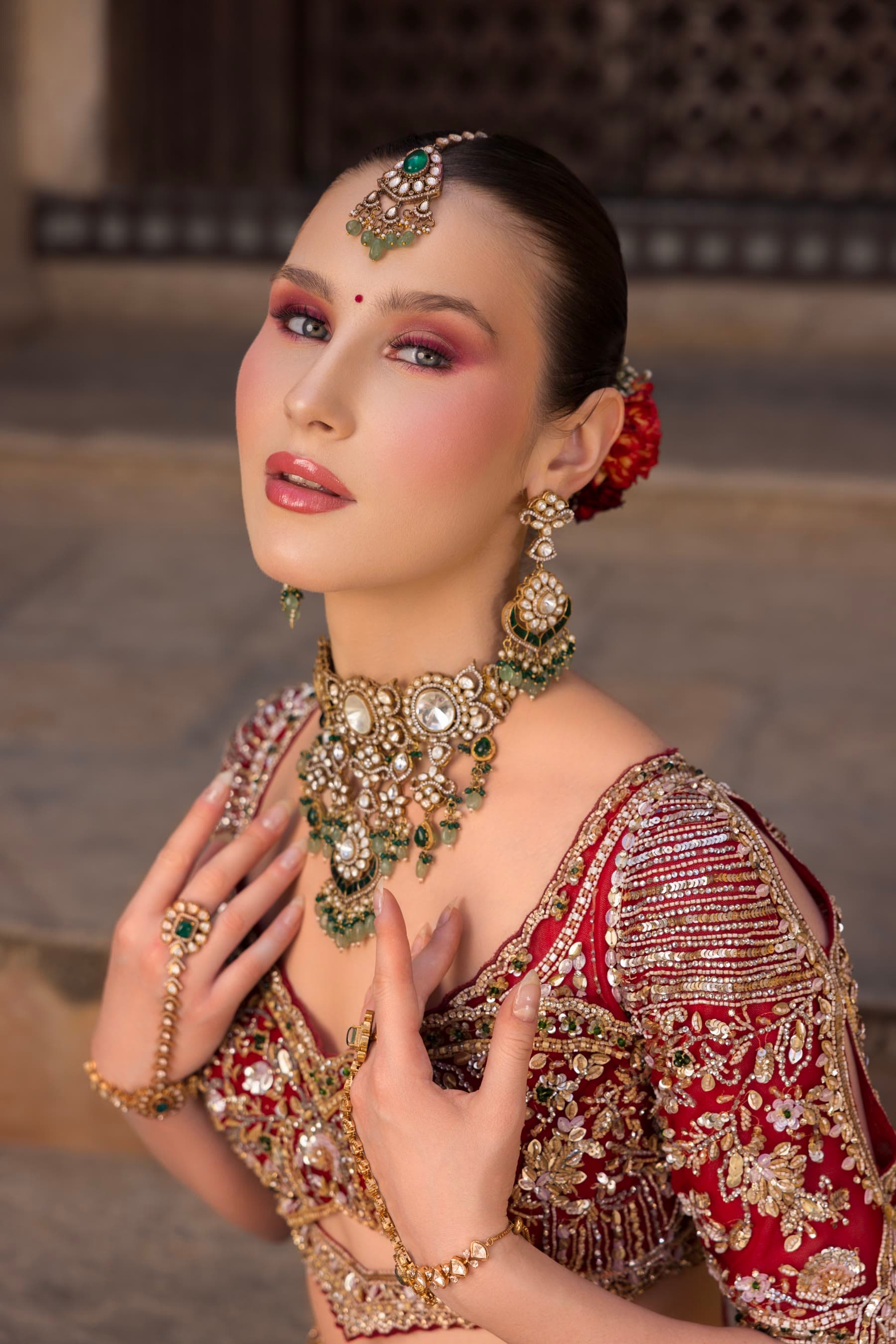 Rose-toned eye and a gold choker, close