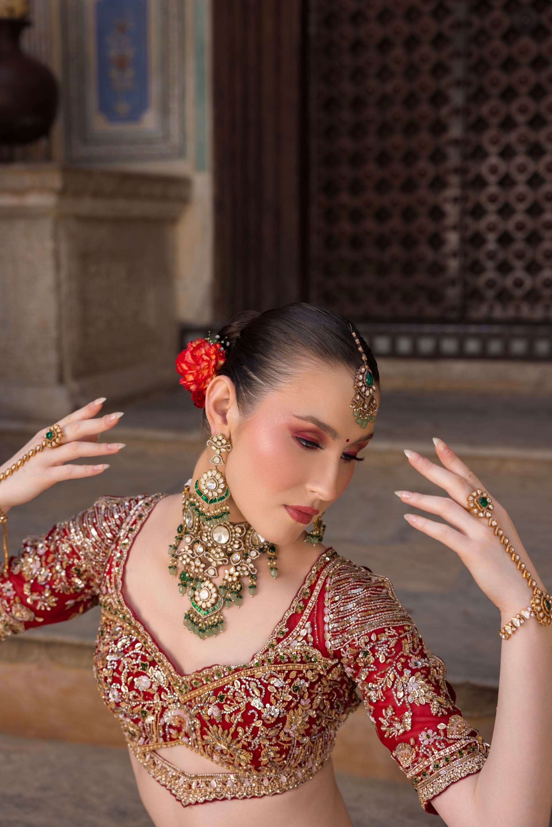 A bride mid-movement, both hands lifted