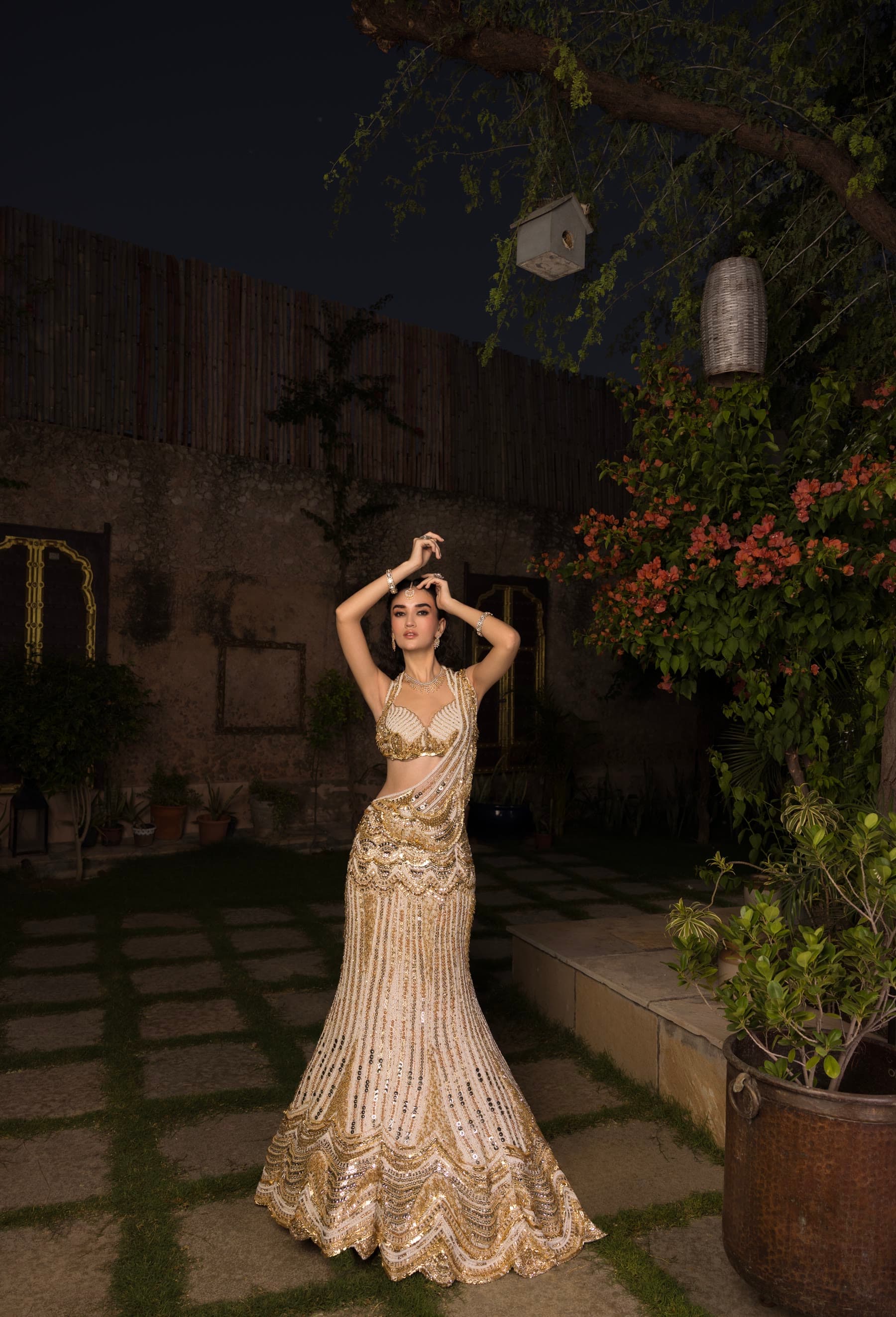 The night garden in full, the bride against the old wall